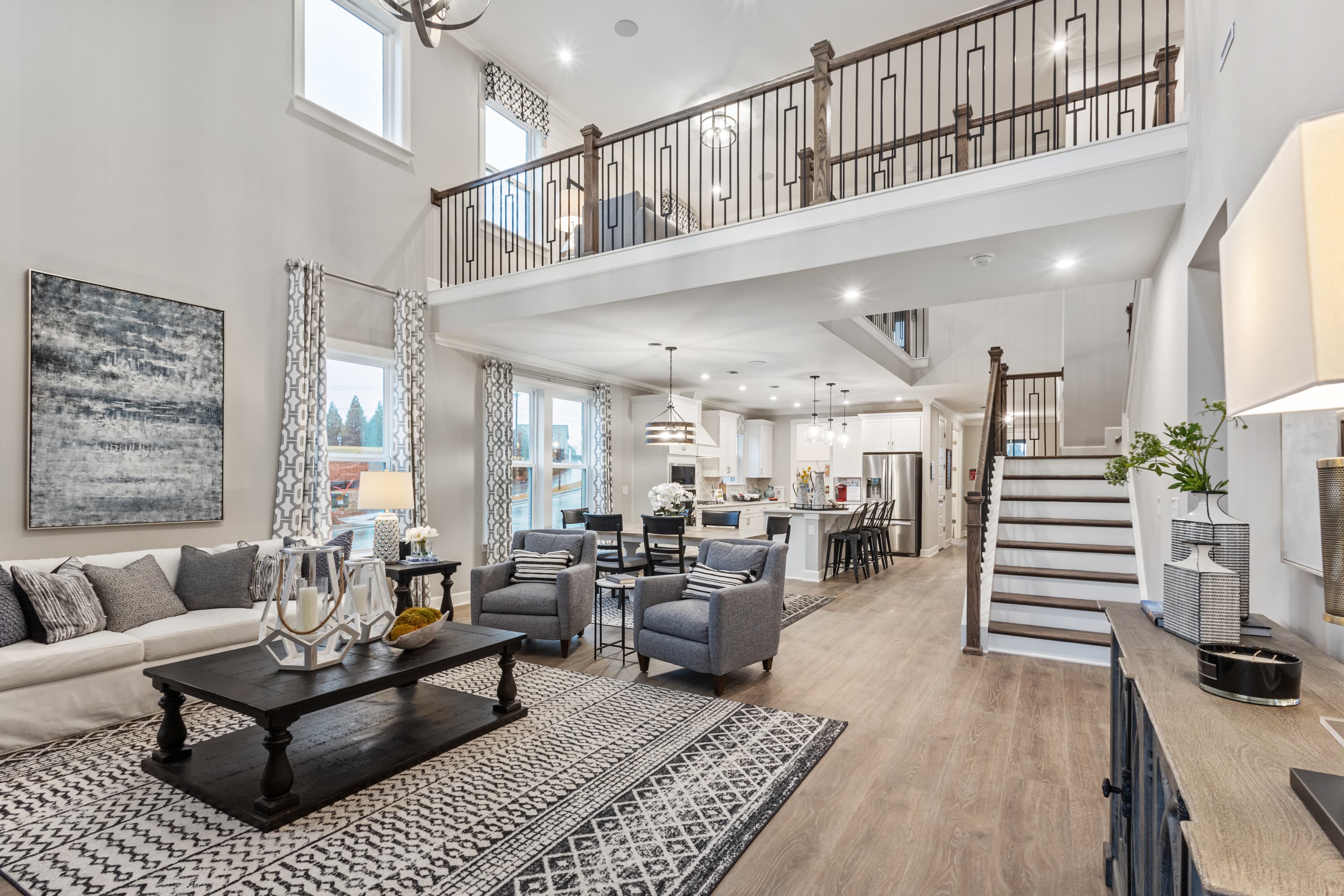 great room and dining room with 2-story ceiling