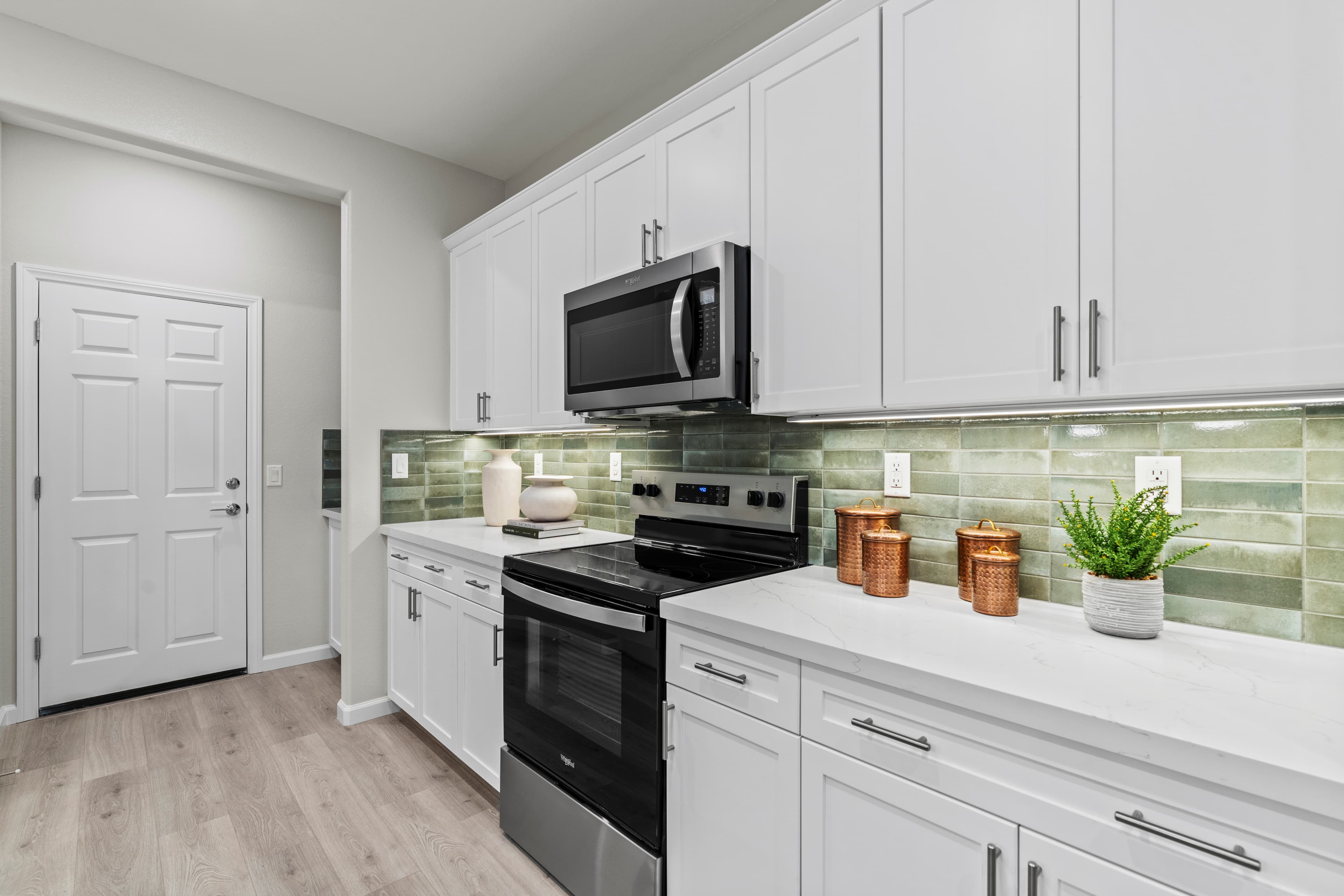 kitchen with white cabinets and white countertops