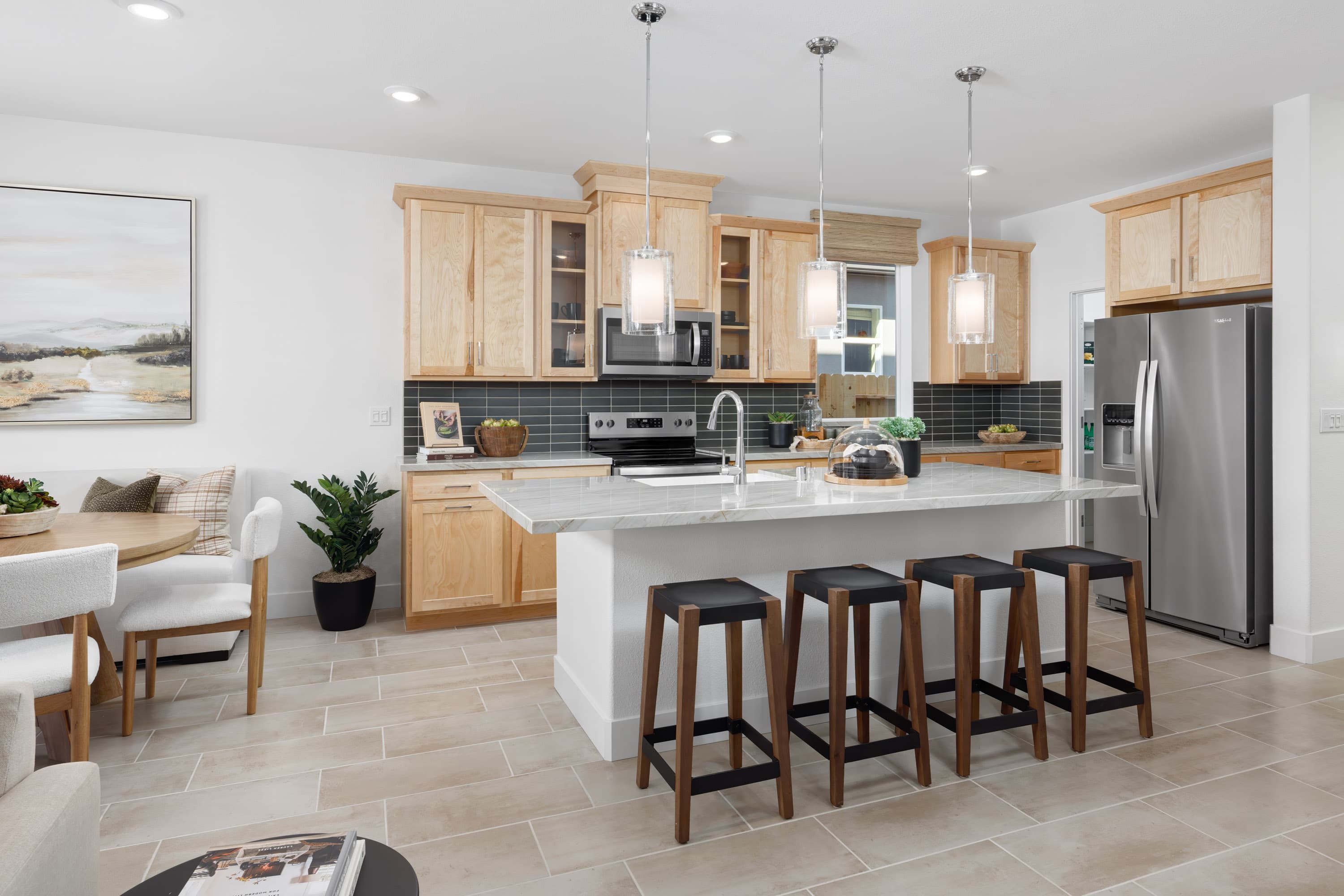 kitchen with light wood cabinets and wood floors