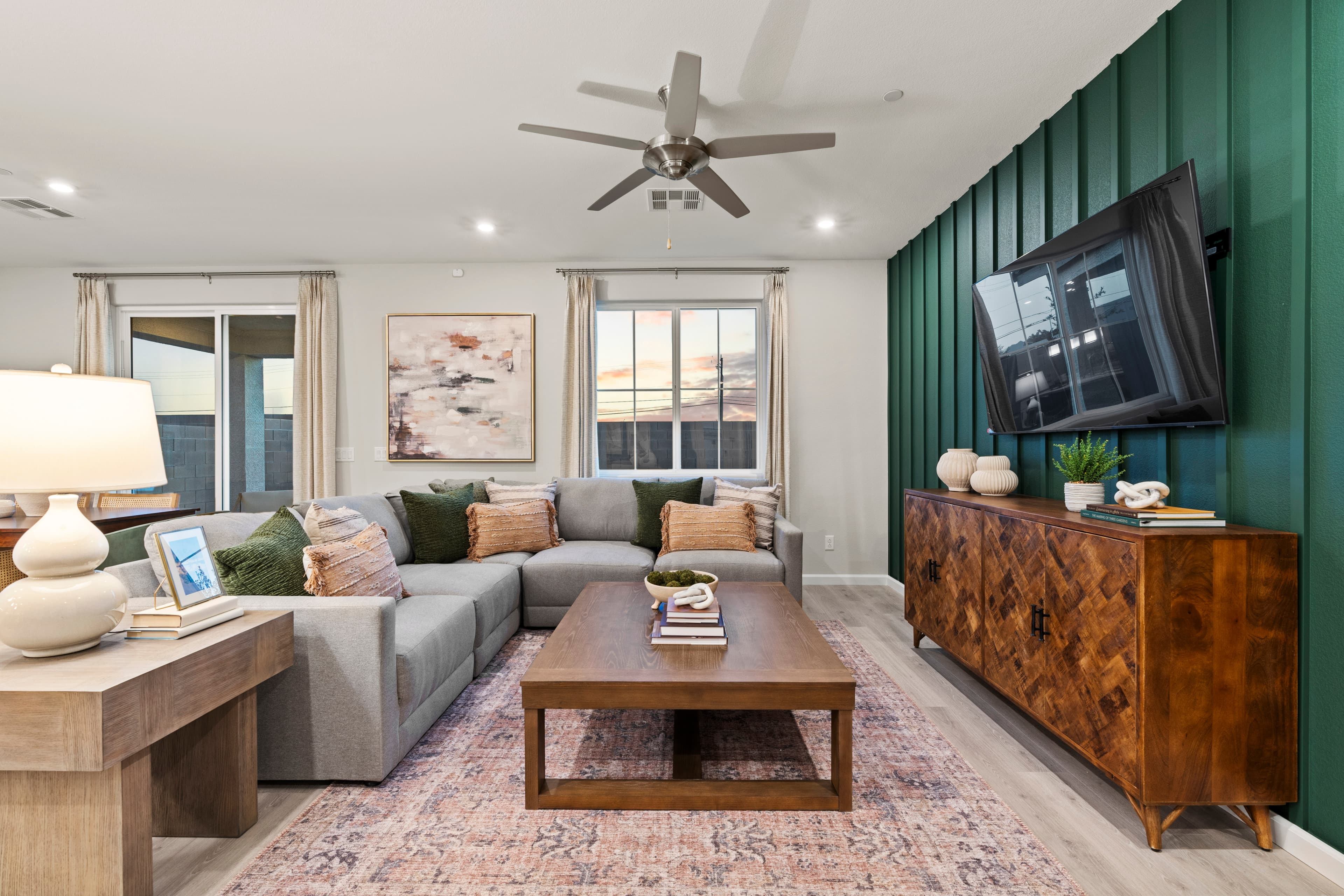living room with couch and green accent wall
