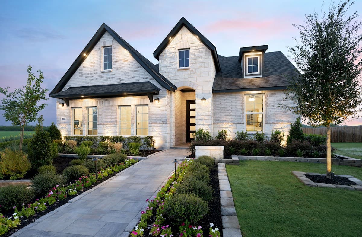 exterior with brick, stone & a covered porch