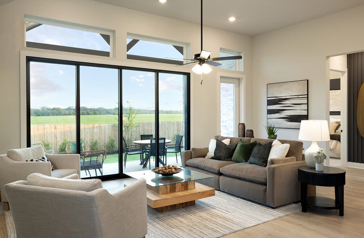 great room with sliding glass door & brown floors